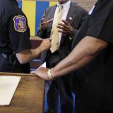 Rep. Scott talks with local police officials.